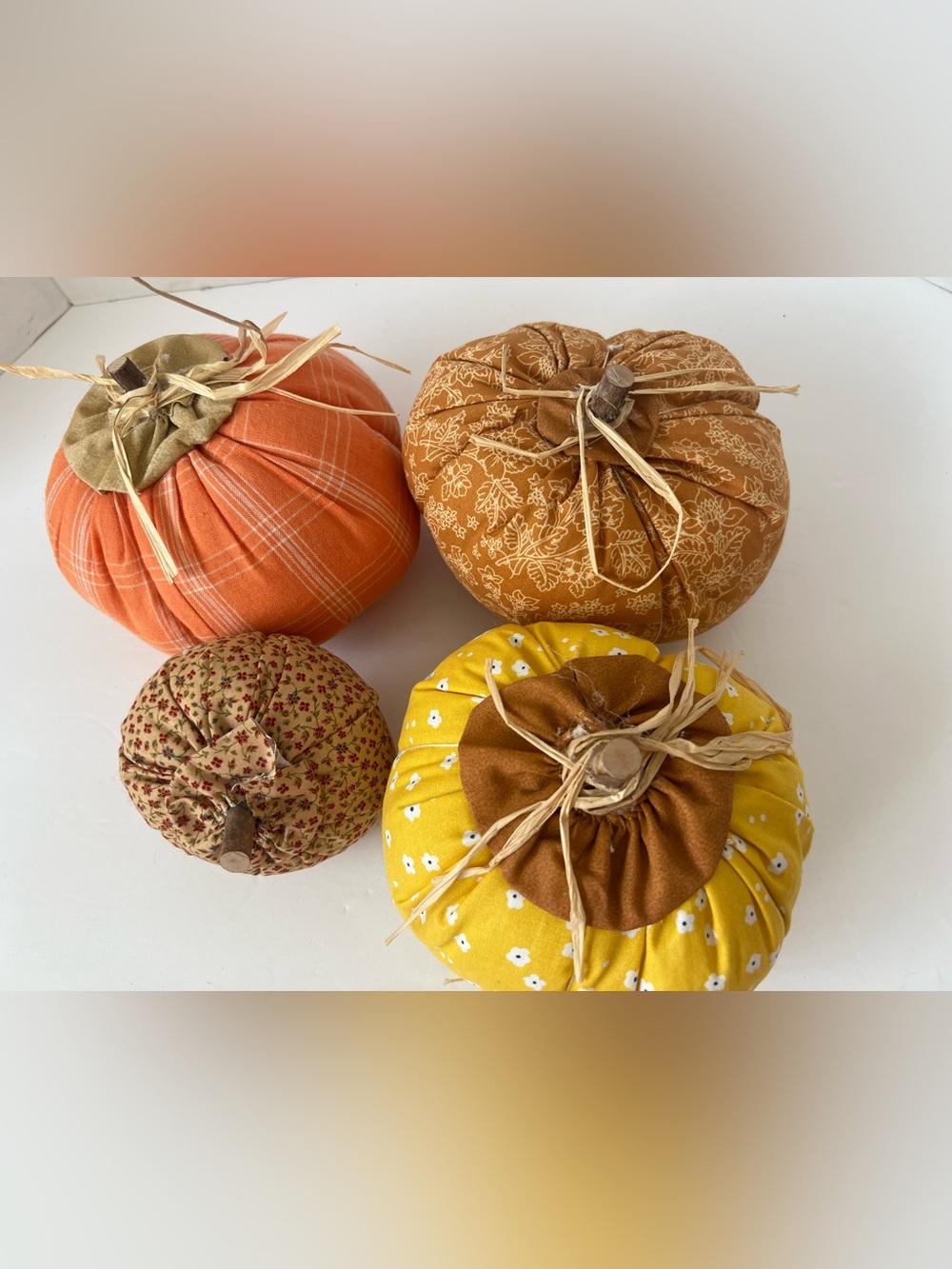 Four handmade pumpkins in my smoke free sewing/craft room.